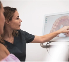 A patient viewing an iTero digital scan during a clear aligner assessment